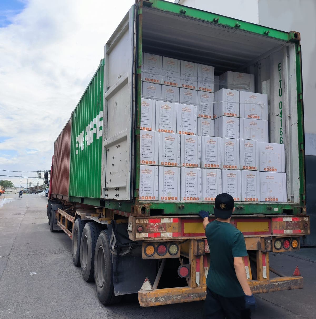 Final QC and container loading — units inspected and packed for shipment